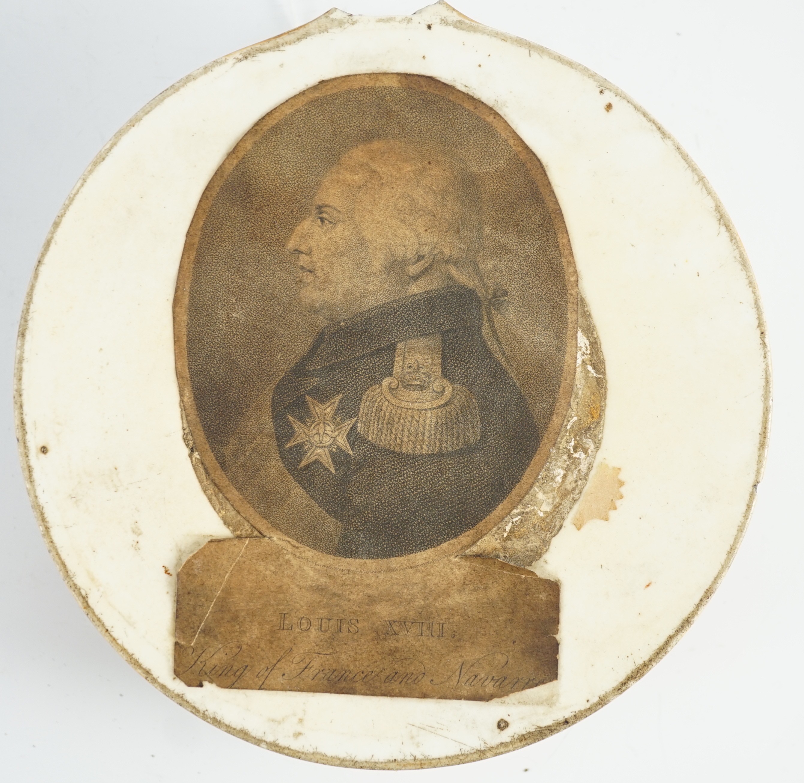 A Louis XVIII glass sulphide portrait plaque, in a gilded porcelain frame, c.1820, 14.5cm diameter